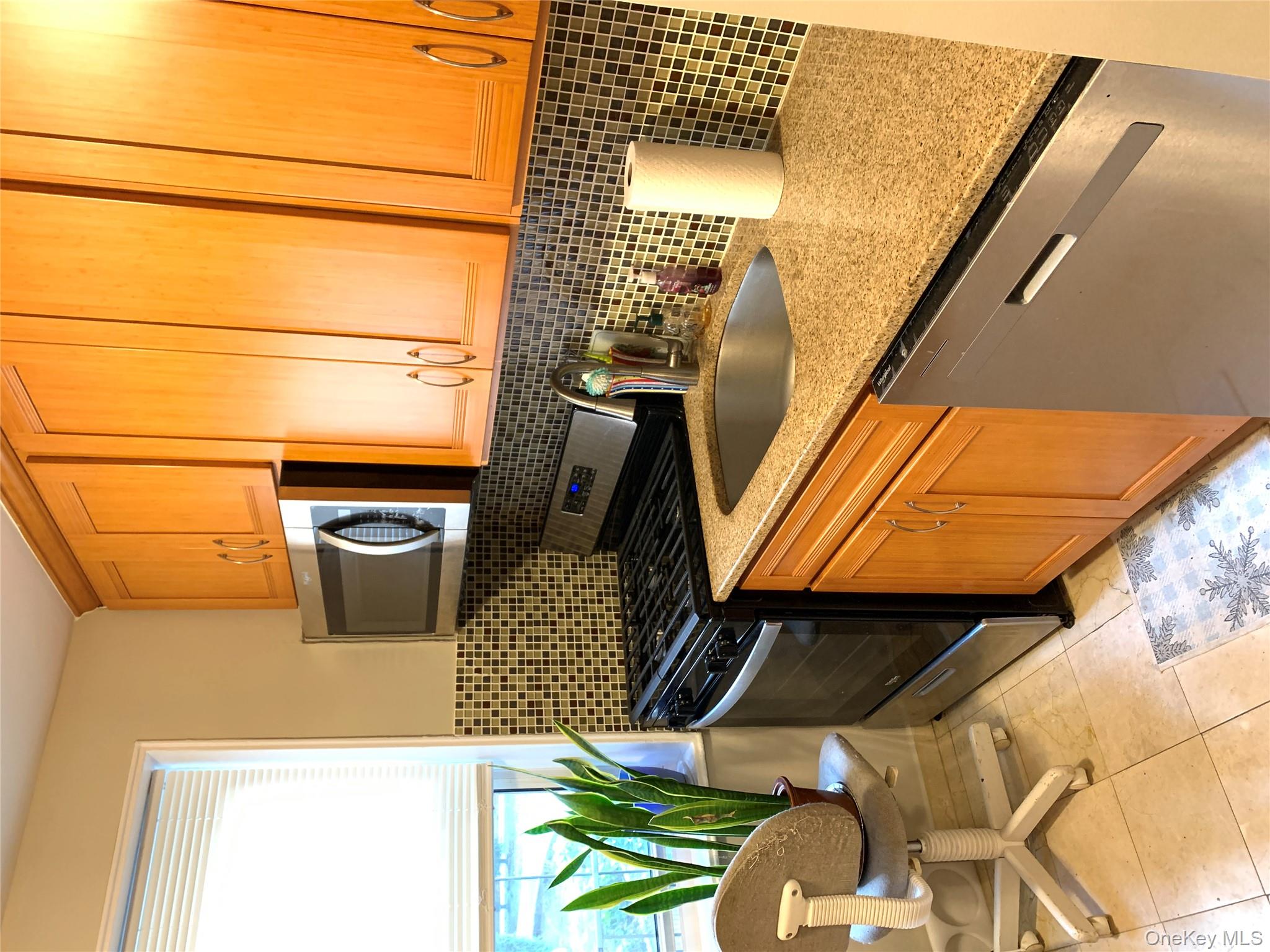 30 Davenport Avenue, Unit 1B New Rochelle, NY 10805 - Photo 6 of 16 a kitchen with a sink and cabinets