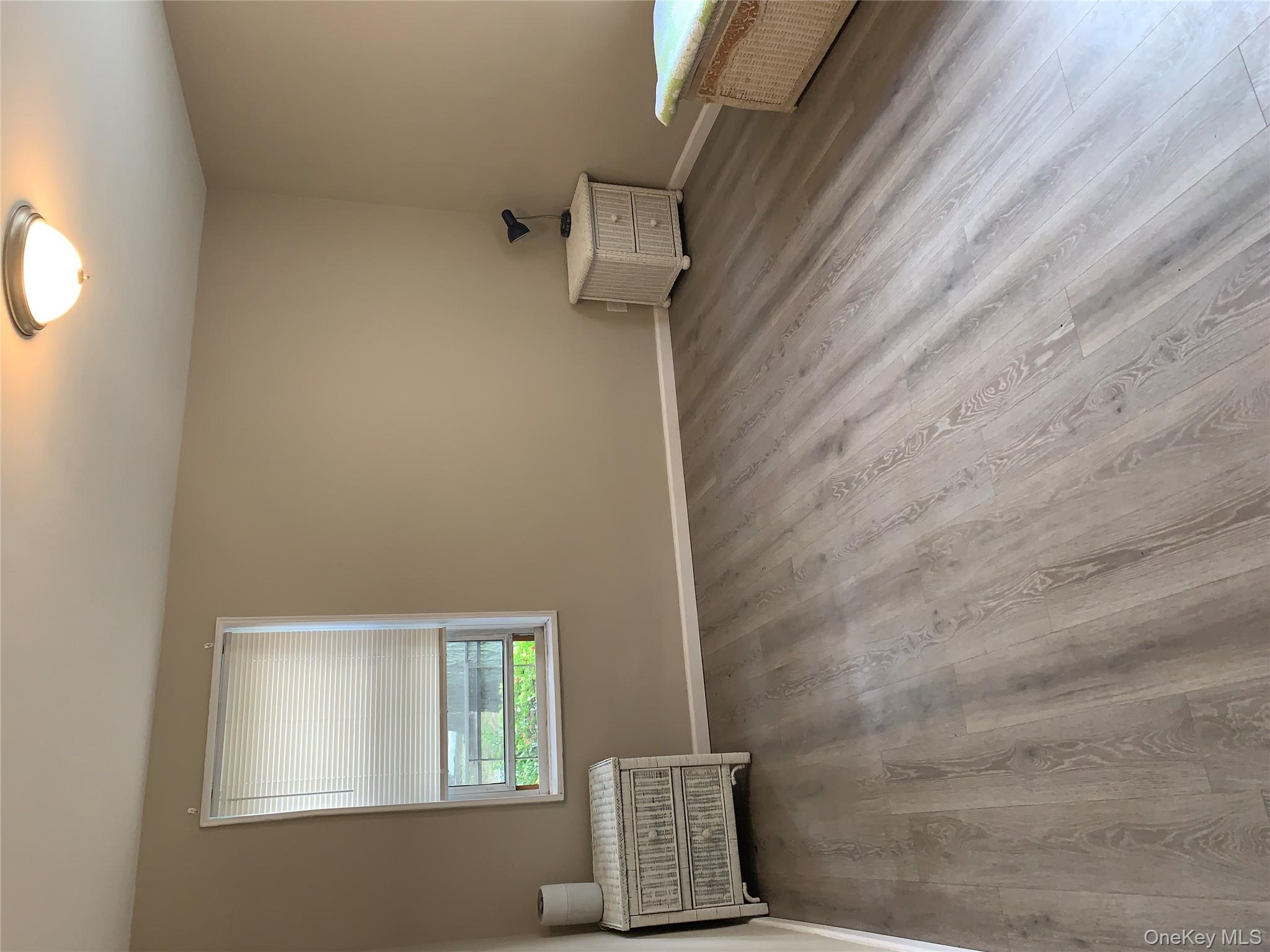 30 Davenport Avenue, Unit 1B New Rochelle, NY 10805 - Photo 7 of 16 a view of an empty room and window