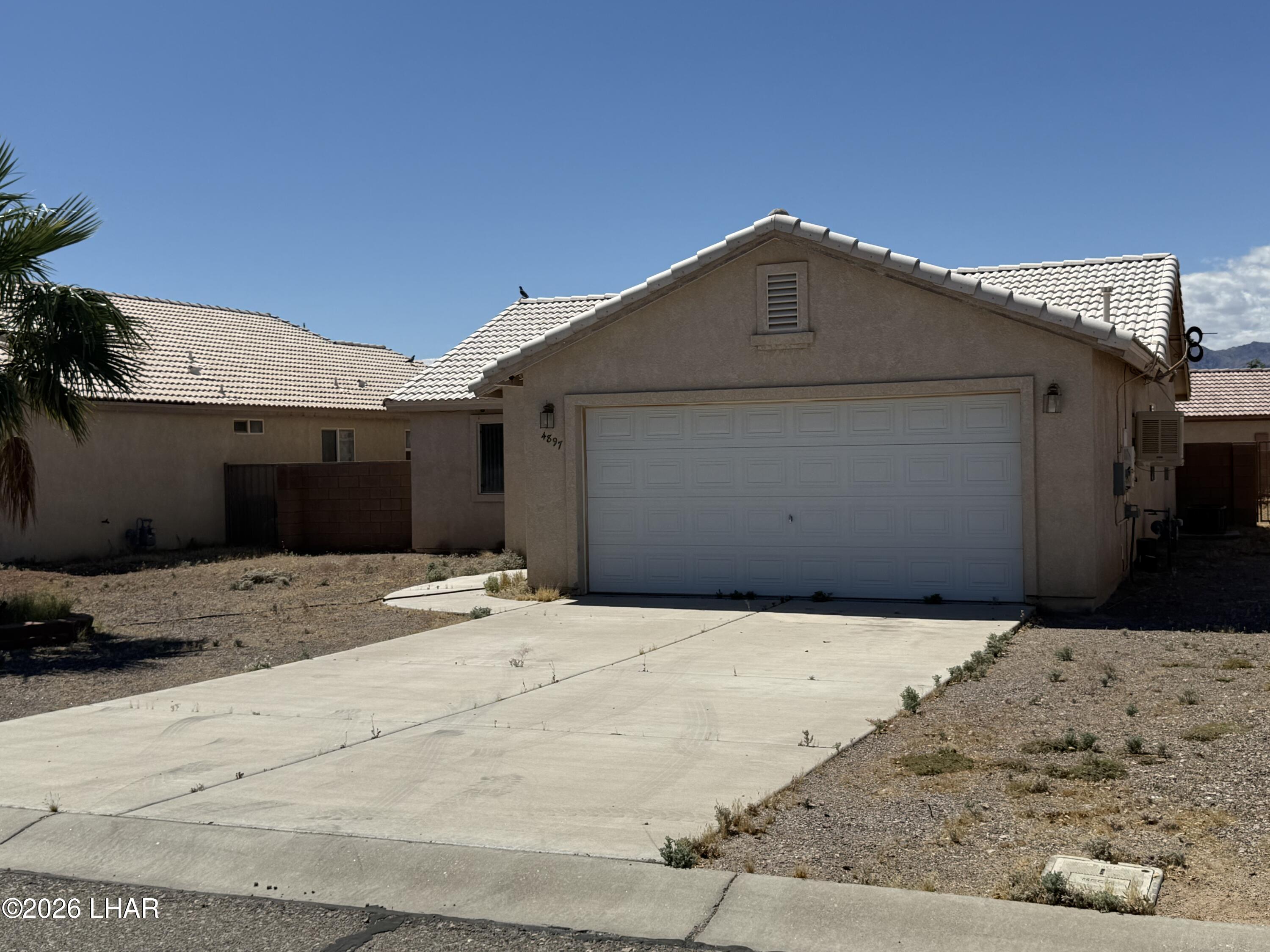 4897 South Rinaldi Drive Fort Mohave, AZ 86426 - Photo 22 of 22 a front view of a house