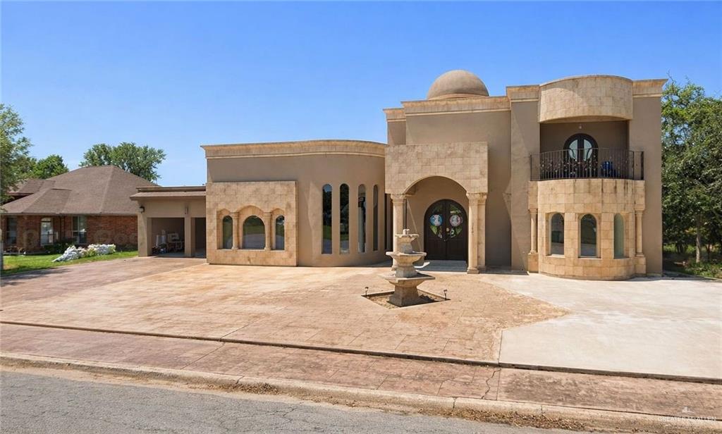302 South 9th Street Hidalgo, TX 78557 - Photo 1 of 3 a front view of a house with a yard