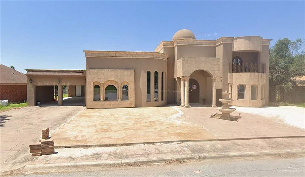 302 South 9th Street Hidalgo, TX 78557 - Photo 2 of 3 a front view of a house with a yard