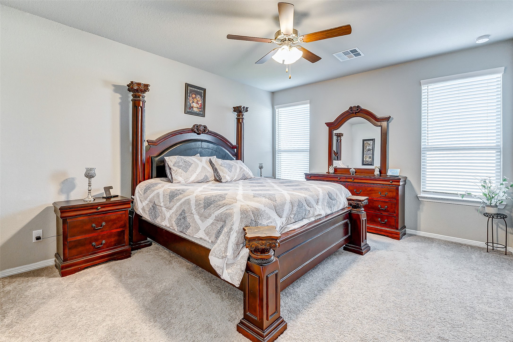 24715 Russet Bluff Trail Houston, TX 77336 - Photo 25 of 31 a bedroom with a bed and a chandelier