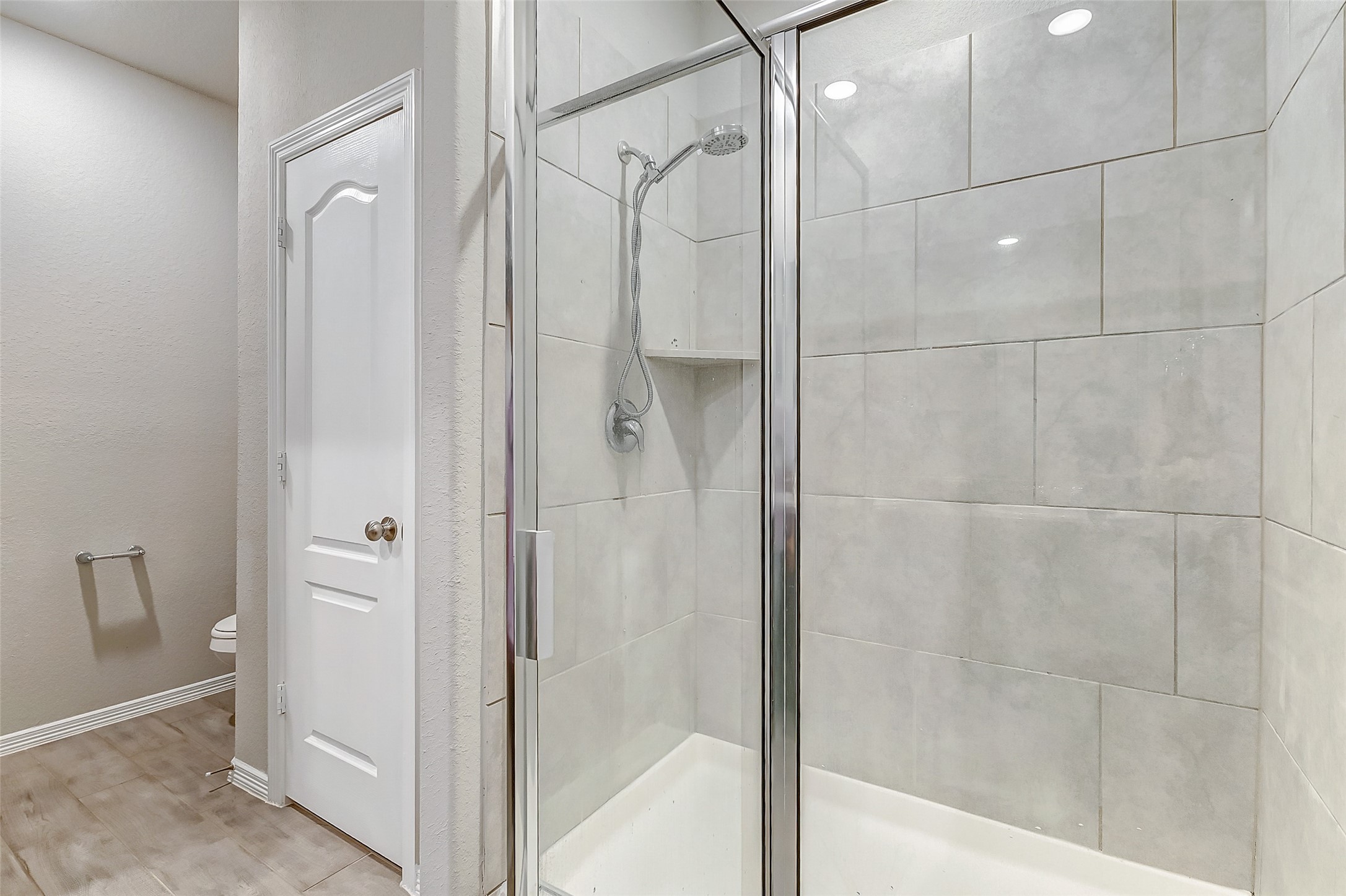 24715 Russet Bluff Trail Houston, TX 77336 - Photo 29 of 31 a bathroom with a shower and a glass door