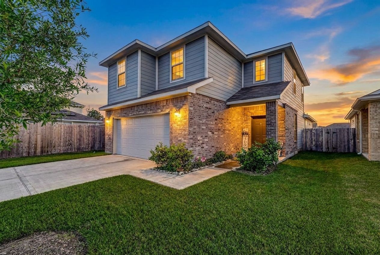 24715 Russet Bluff Trail Houston, TX 77336 - Photo 31 of 31 a front view of a house with a yard and garage