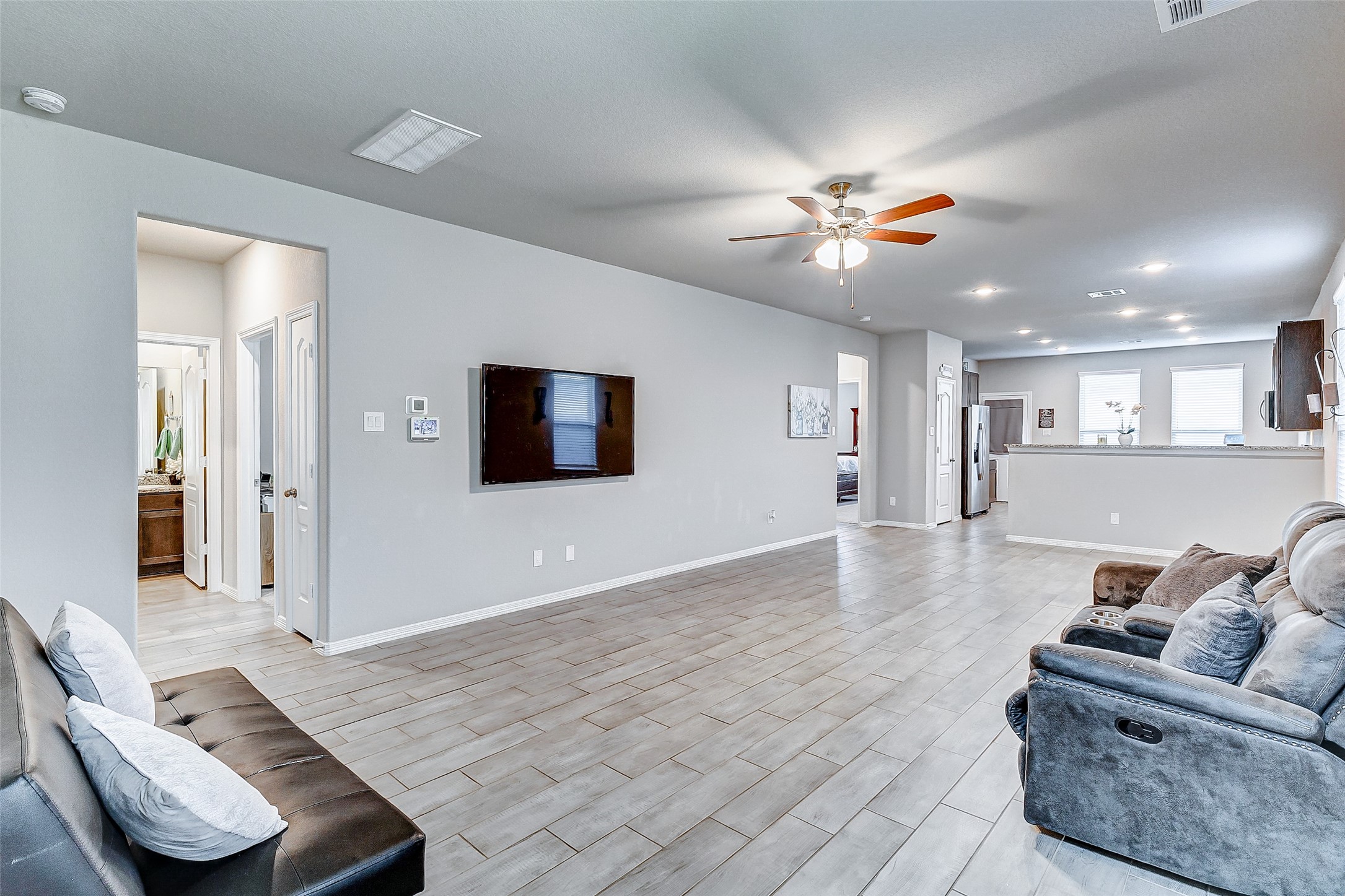 24715 Russet Bluff Trail Houston, TX 77336 - Photo 7 of 31 a living room with furniture and a wooden floor