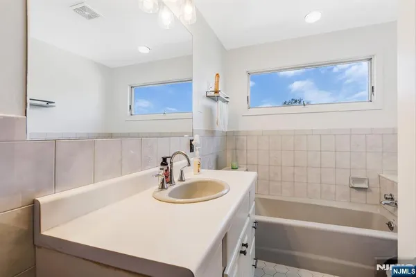 a bathroom with a sink and a bathtub