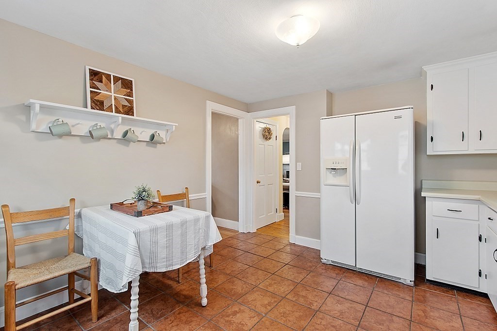 8 Gardner Road Reading, MA 01867 - Photo 11 of 35 a living room with furniture and a dining table