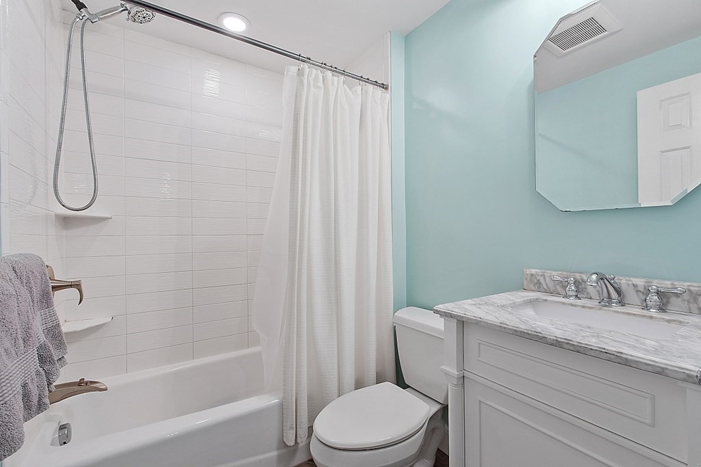 8 Gardner Road Reading, MA 01867 - Photo 16 of 35 a bathroom with a granite countertop toilet sink and shower