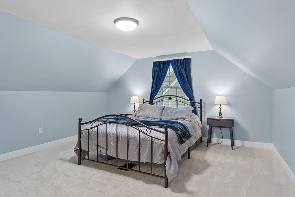 8 Gardner Road Reading, MA 01867 - Photo 21 of 35 a bedroom with a bed and a window
