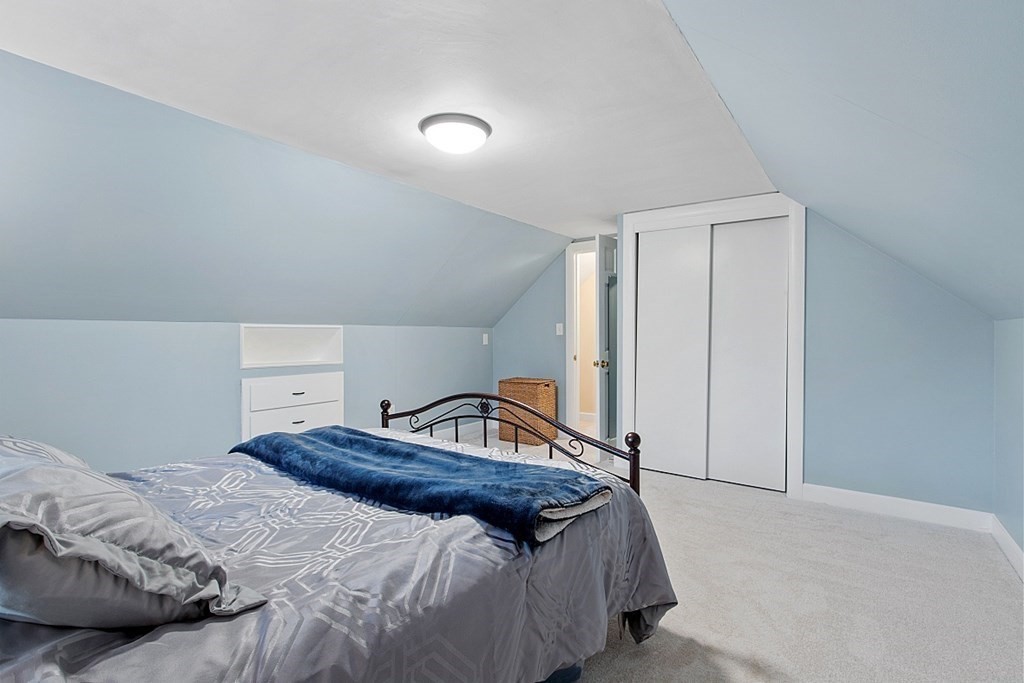 8 Gardner Road Reading, MA 01867 - Photo 22 of 35 a bedroom with a bed and a closet