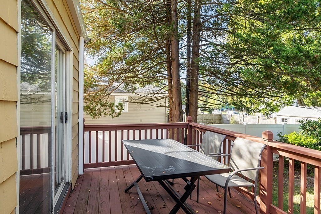 8 Gardner Road Reading, MA 01867 - Photo 29 of 35 a view of a balcony with furniture and wooden deck