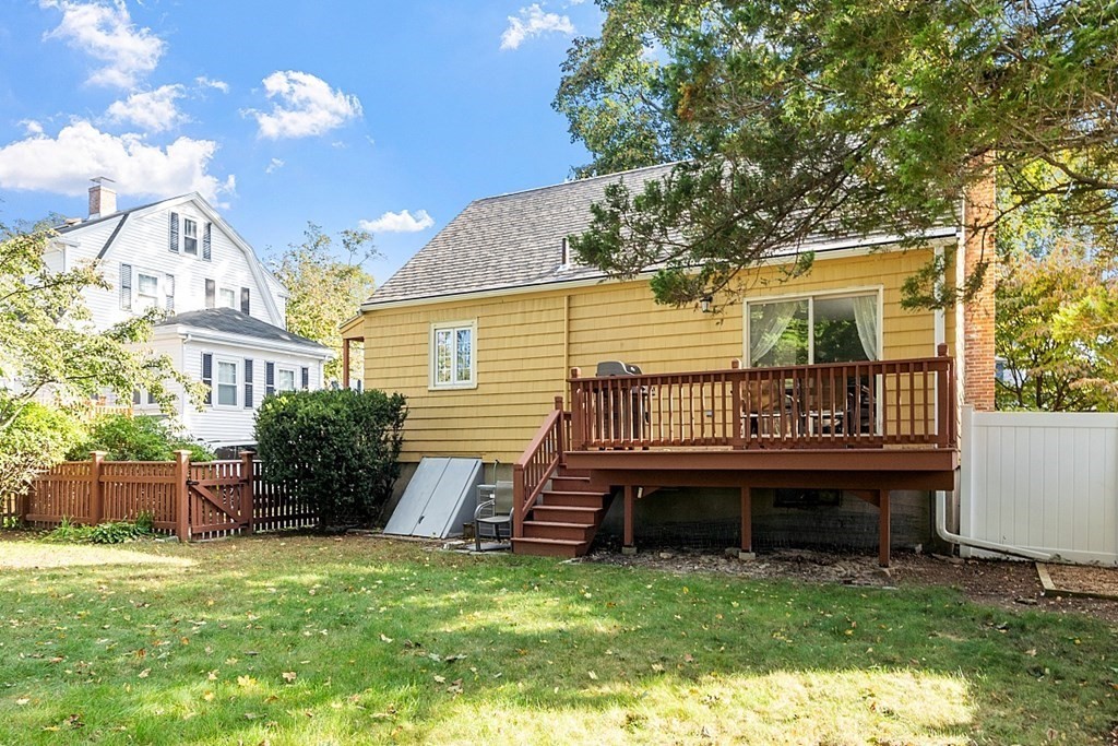 8 Gardner Road Reading, MA 01867 - Photo 30 of 35 a view of a house with a backyard porch and sitting area