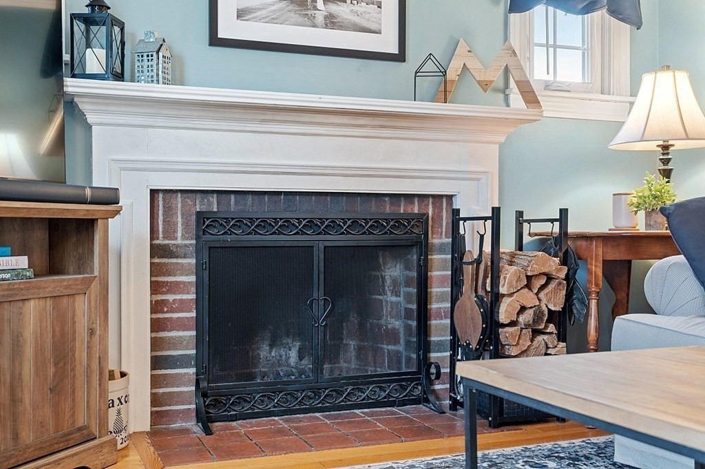 8 Gardner Road Reading, MA 01867 - Photo 4 of 35 a view of a livingroom with furniture and a fireplace