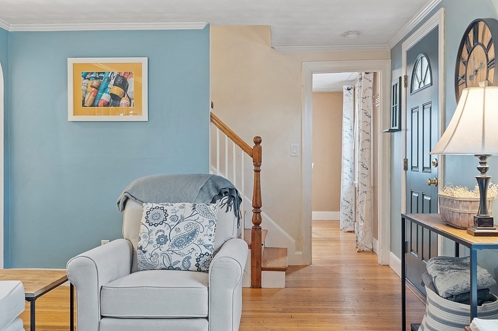 8 Gardner Road Reading, MA 01867 - Photo 6 of 35 a living room with furniture and a painting on the wall