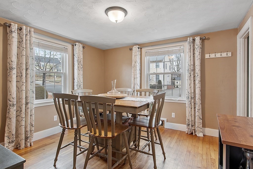 8 Gardner Road Reading, MA 01867 - Photo 9 of 35 a view of a dining room with furniture window and wooden floor