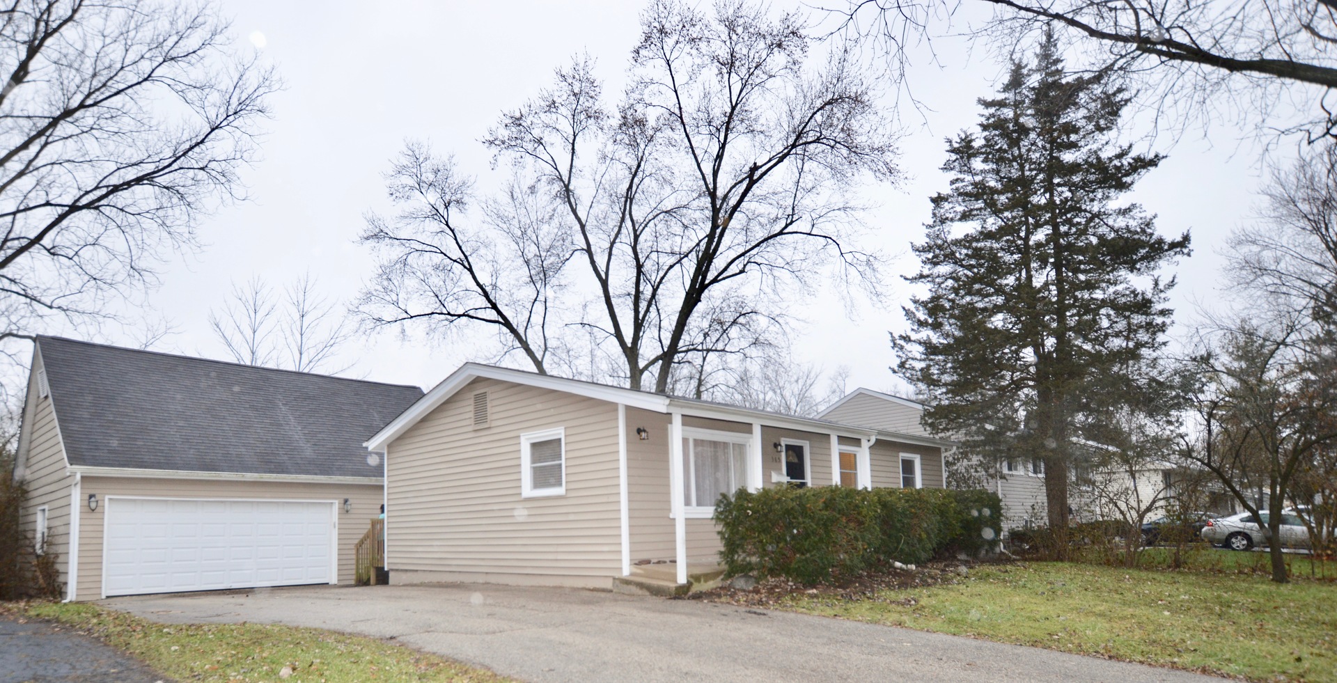 385 Willow Road Wauconda, IL 60084 - Photo 1 of 22 a front view of a house with garden