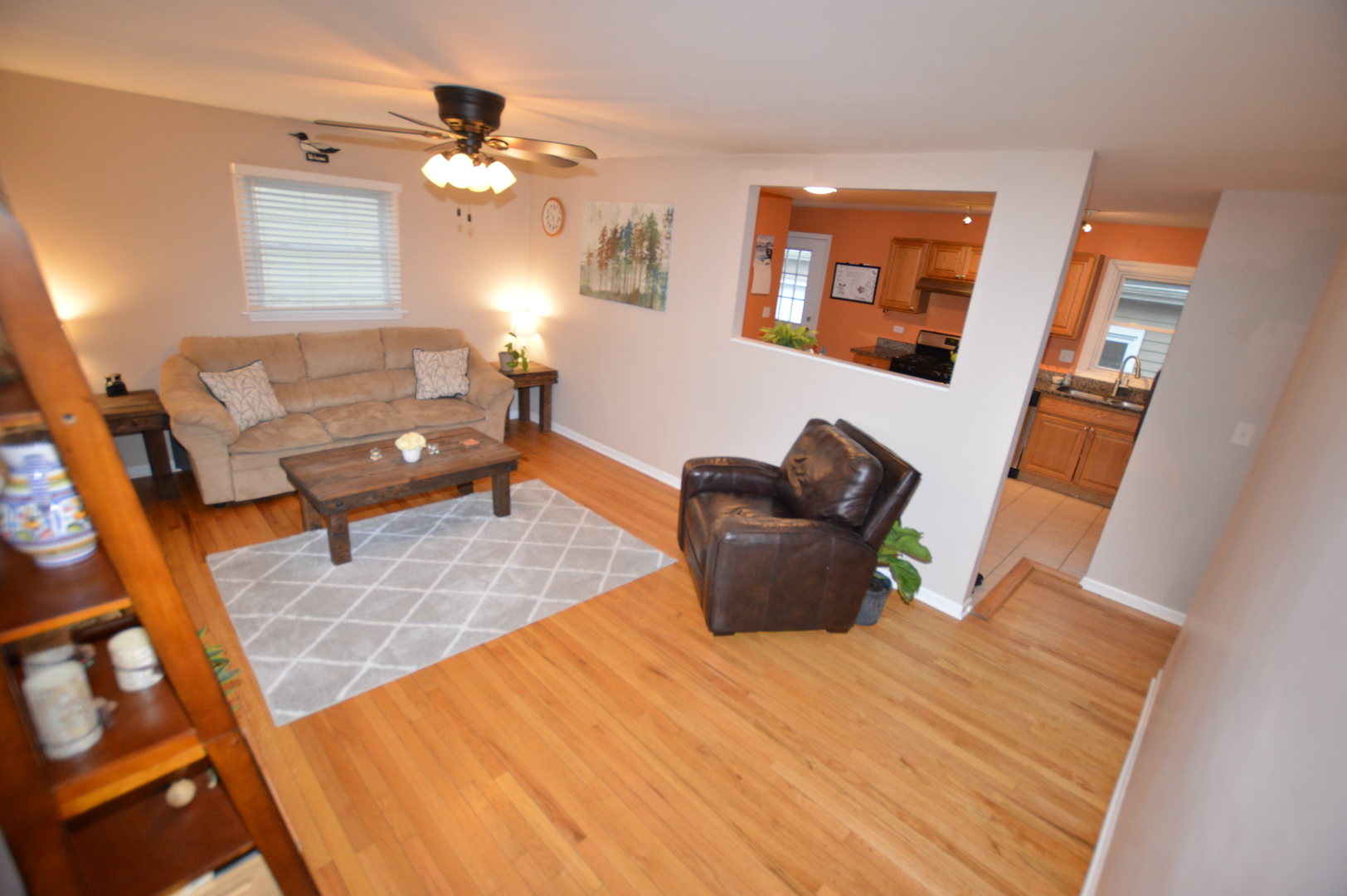 385 Willow Road Wauconda, IL 60084 - Photo 2 of 22 a living room with furniture and a chandelier