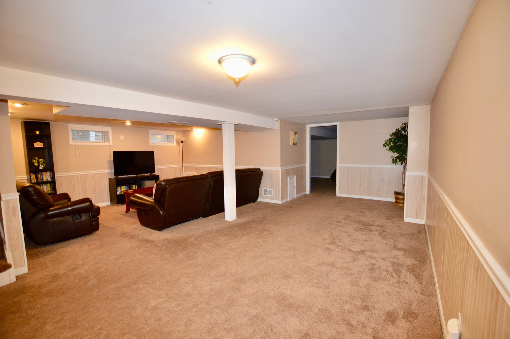 385 Willow Road Wauconda, IL 60084 - Photo 17 of 22 a living room with furniture and a flat screen tv