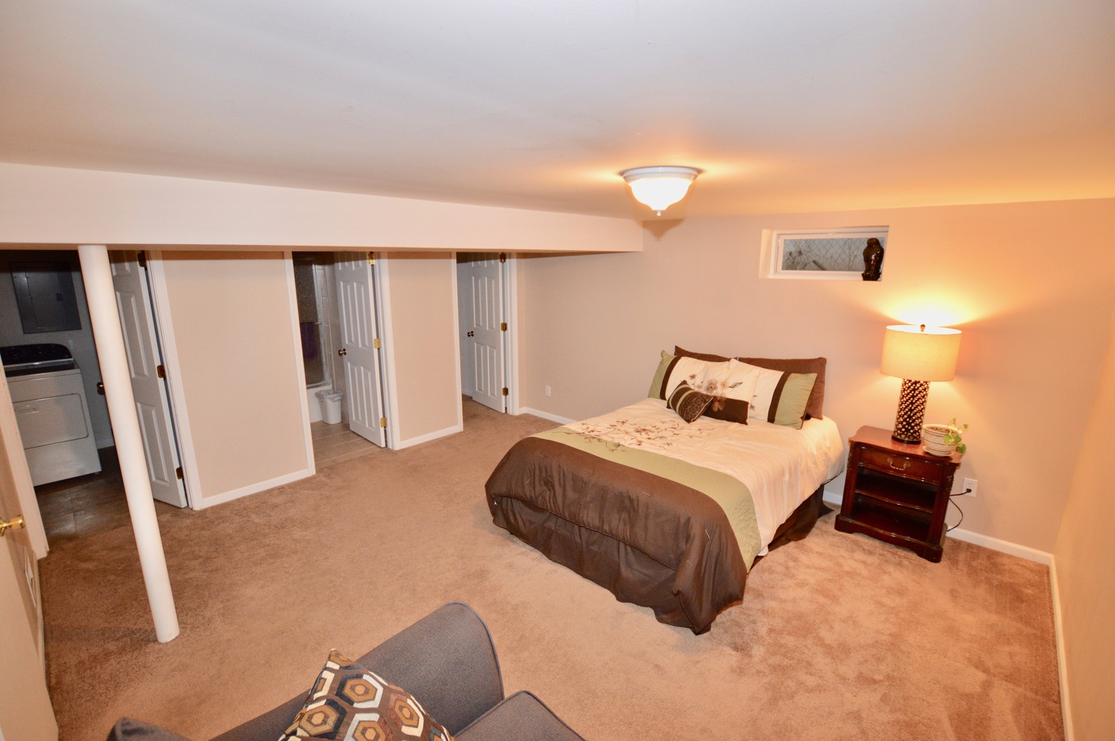 385 Willow Road Wauconda, IL 60084 - Photo 9 of 22 a bedroom with a bed and a flat tv screen on dresser