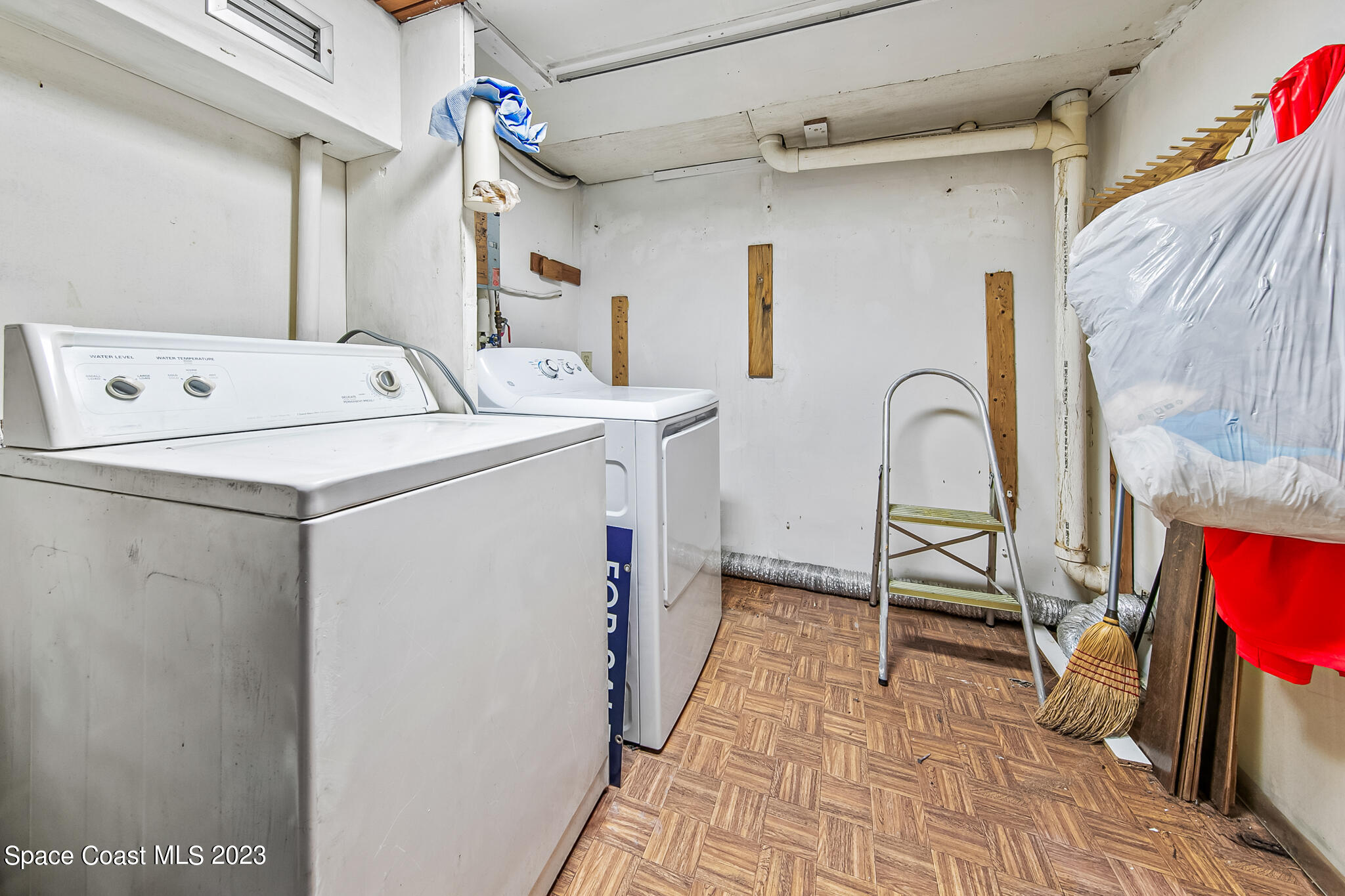 877 Sunset Drive Melbourne, FL 32935 - Photo 33 of 49 a utility room with dryer and washer