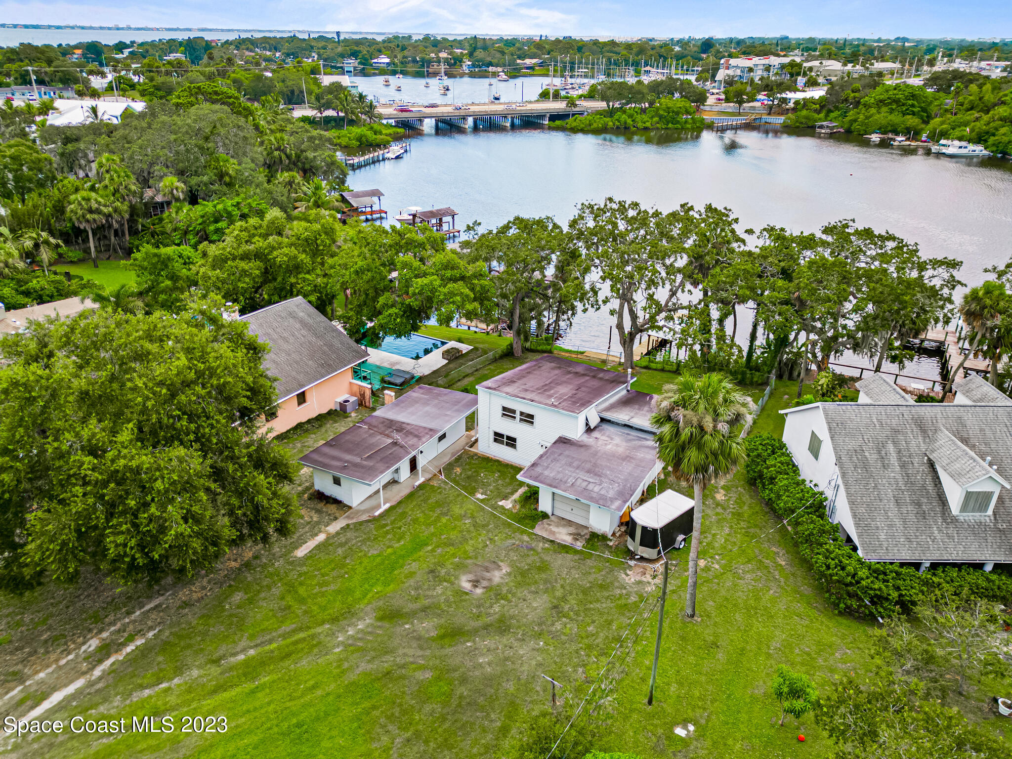 877 Sunset Drive Melbourne, FL 32935 - Photo 42 of 49 an aerial view of a house with a lake view