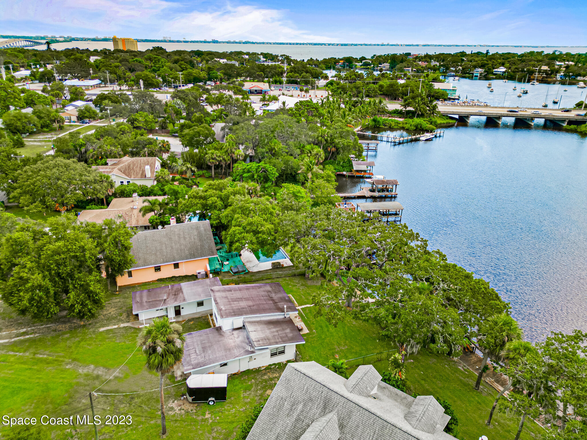 877 Sunset Drive Melbourne, FL 32935 - Photo 43 of 49 an aerial view of a house with a garden lake view