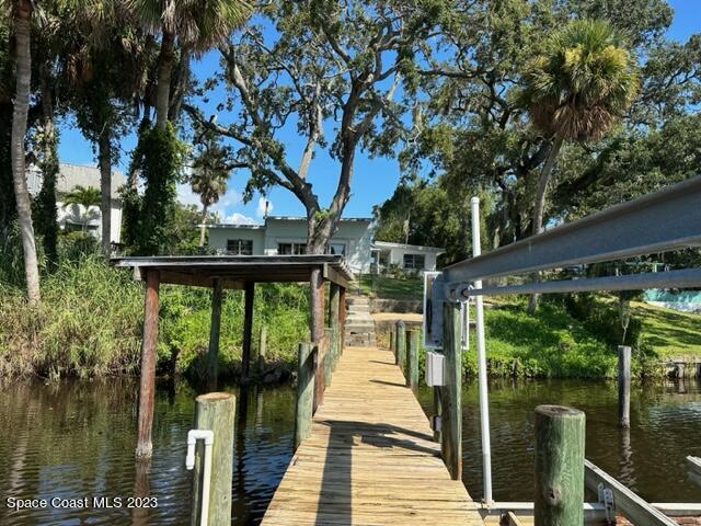 877 Sunset Drive Melbourne, FL 32935 - Photo 46 of 49 a deck with trees in front of it
