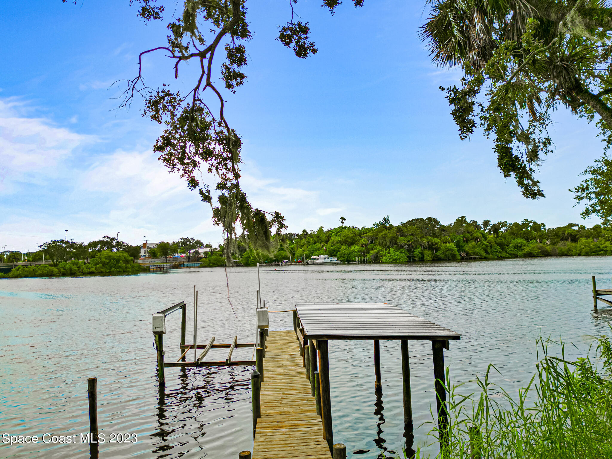877 Sunset Drive Melbourne, FL 32935 - Photo 5 of 49 a view of a lake from a balcony