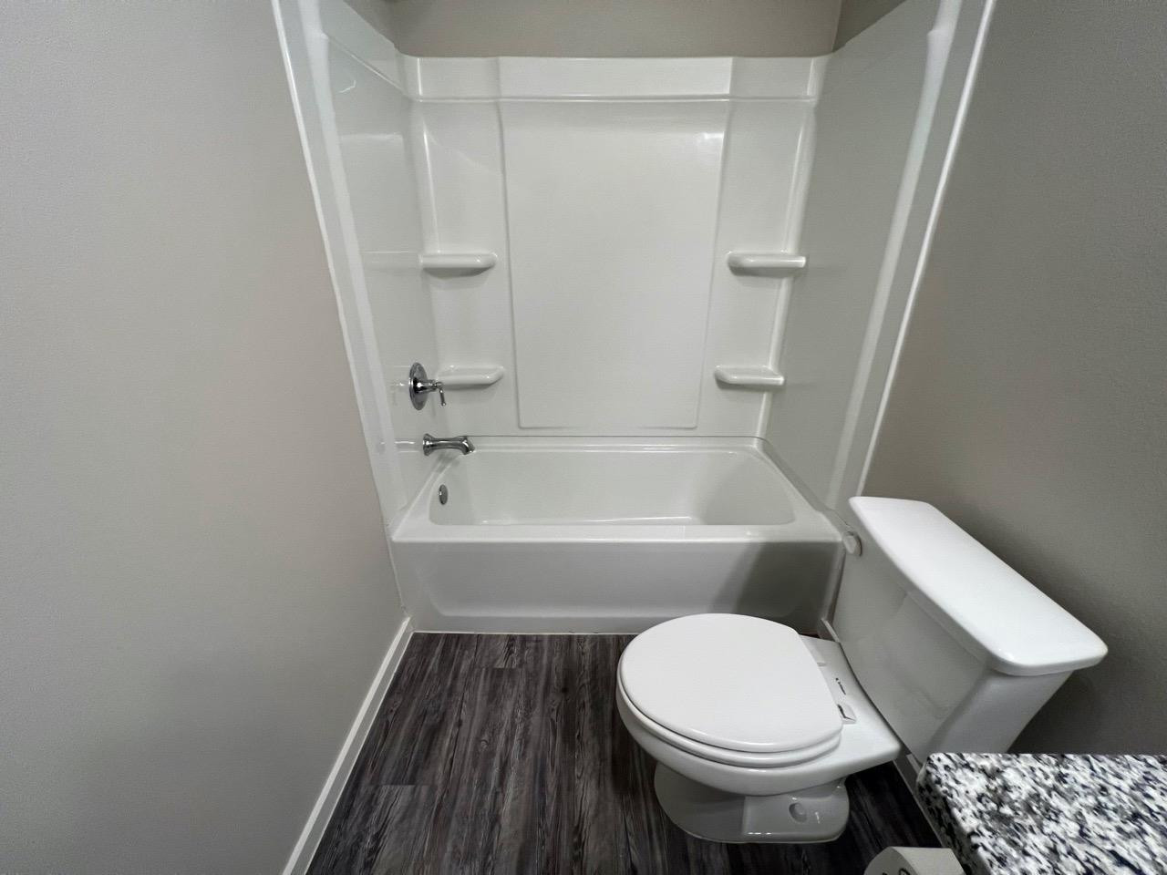 2125 North Texas Avenue, Unit B Lubbock, TX 79403 - Photo 8 of 21 a bathroom with a sink and a toilet
