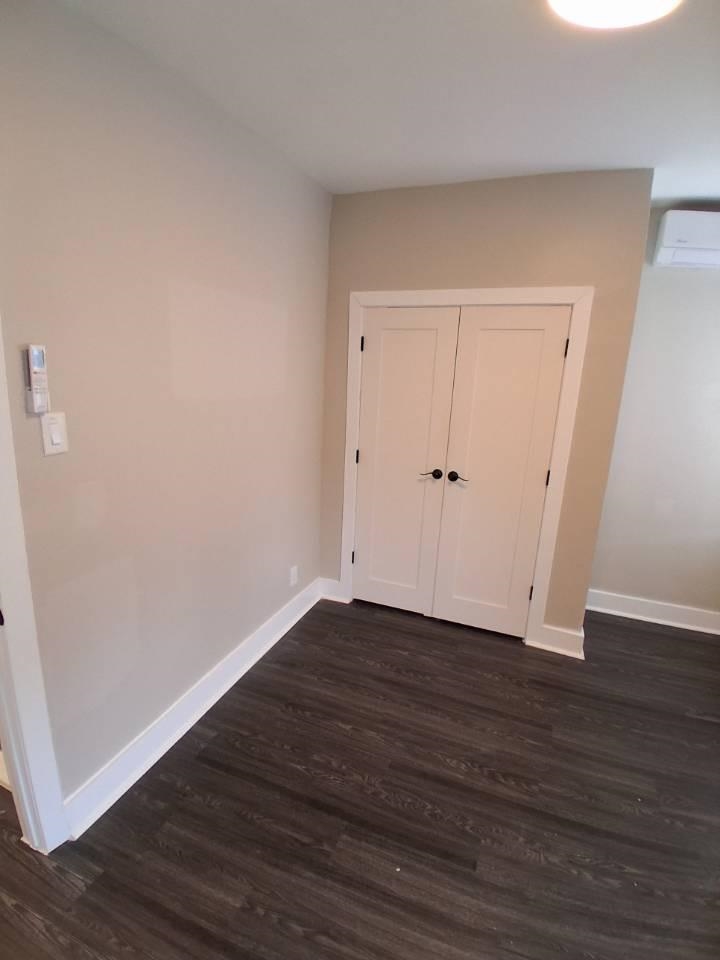 18 Reed Street, Unit 13 Jersey City, NJ 07304 - Photo 2 of 6 a view of an empty room with wooden floor