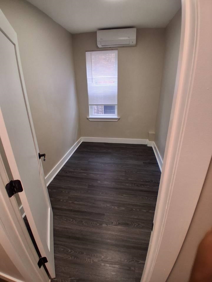18 Reed Street, Unit 13 Jersey City, NJ 07304 - Photo 5 of 6 a view of an empty room with wooden floor and a window