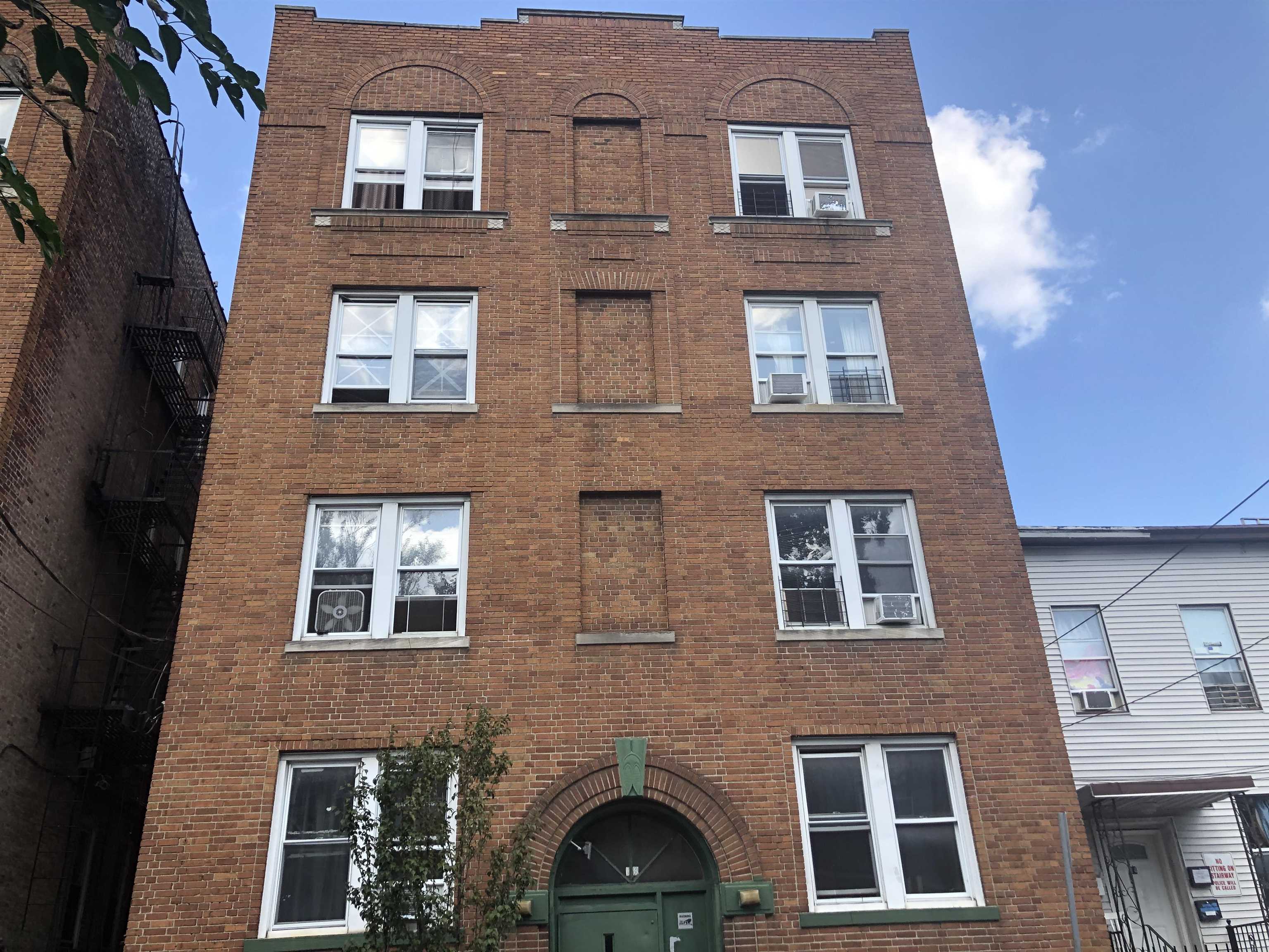 18 Reed Street, Unit 13 Jersey City, NJ 07304 - Photo 6 of 6 a front view of a building with windows