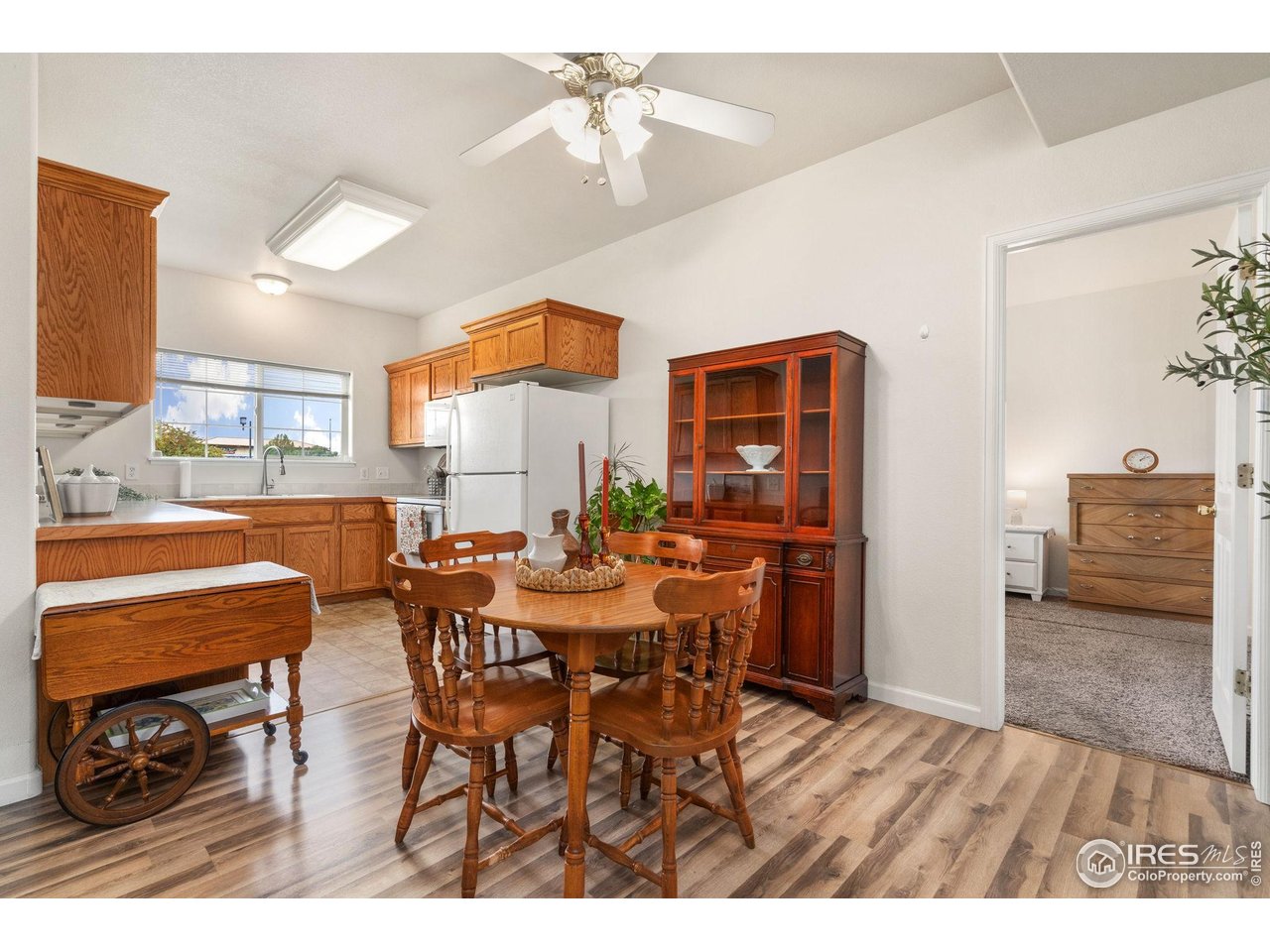 1343 Lake Circle, Unit B Windsor, CO 80550 - Photo 7 of 22 Easy flow, the open layout connects the living, dining, and kitchen spaces.