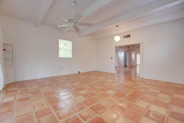 a view of a kitchen with a sink and cabinets