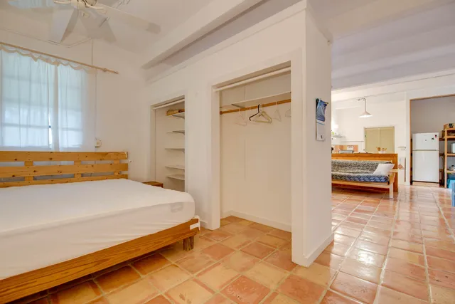 a bedroom with a bed and a view of bathroom