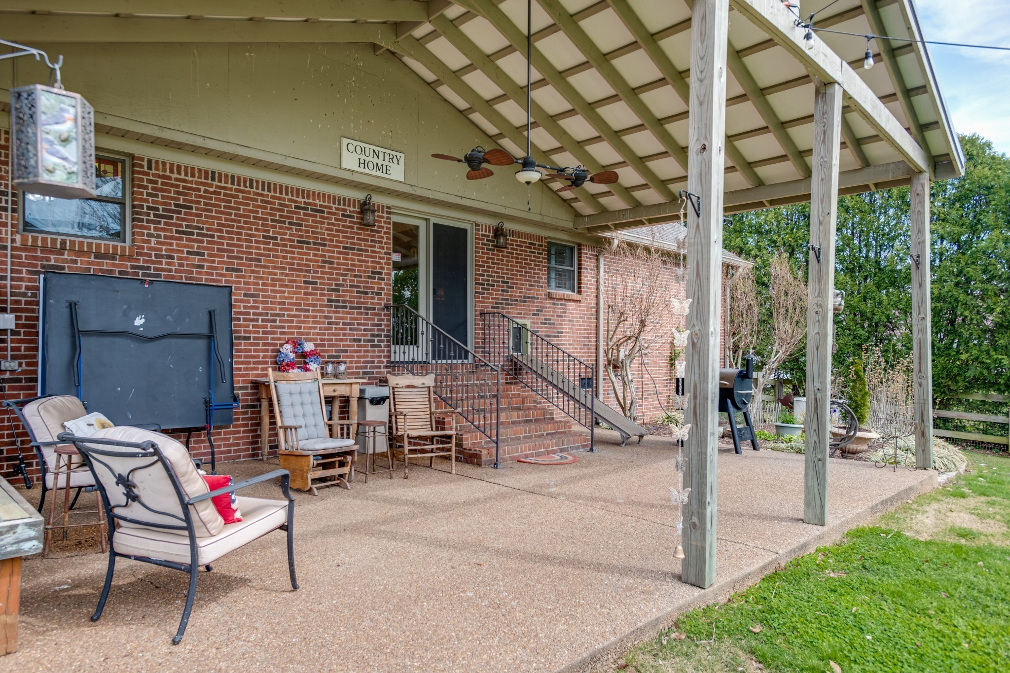 4360 Scott Hollow Road Culleoka, TN 38451 - Photo 5 of 29 a view of a patio with table and chairs and potted plants