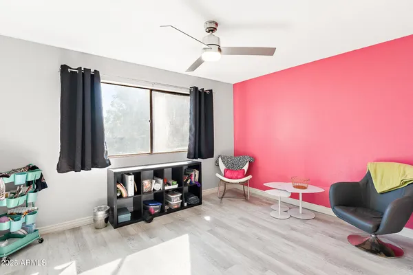 a bedroom with furniture and a window