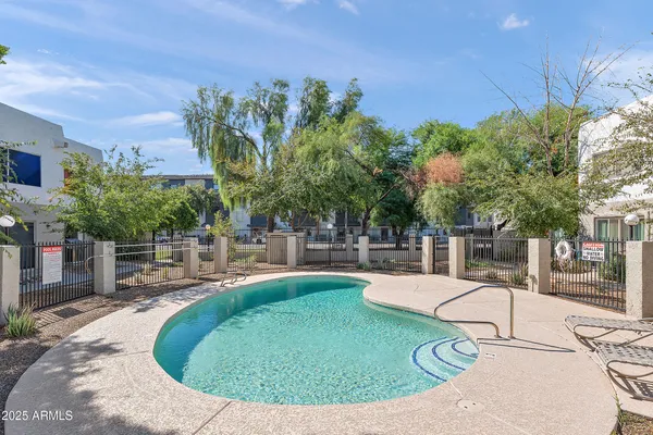 a view of a swimming pool with a patio