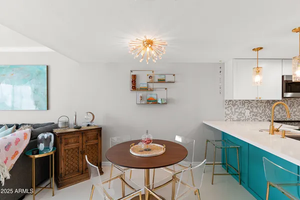 a dining room with furniture and window