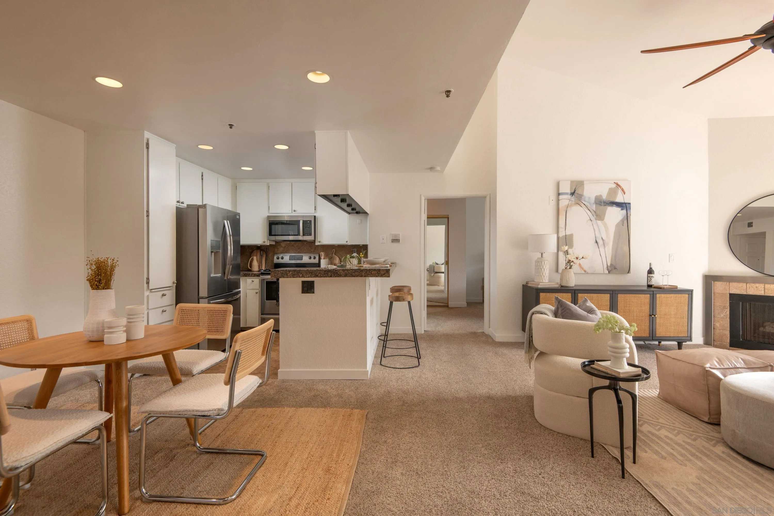 5705 Friars Road, Unit 54 San Diego, CA 92110 - Photo 1 of 30 a living room with furniture and kitchen view