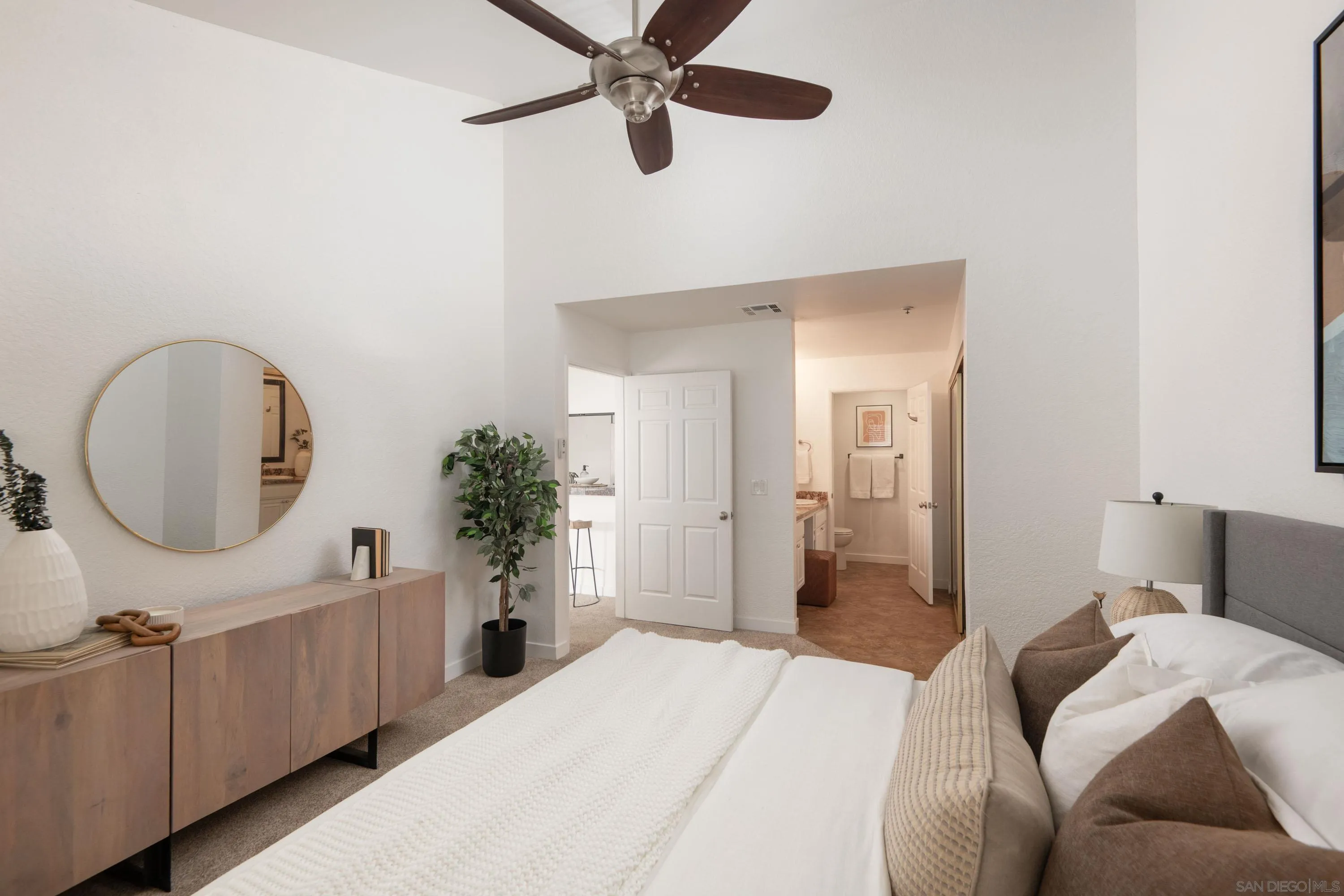 5705 Friars Road, Unit 54 San Diego, CA 92110 - Photo 15 of 30 a bedroom with a bed and a chandelier