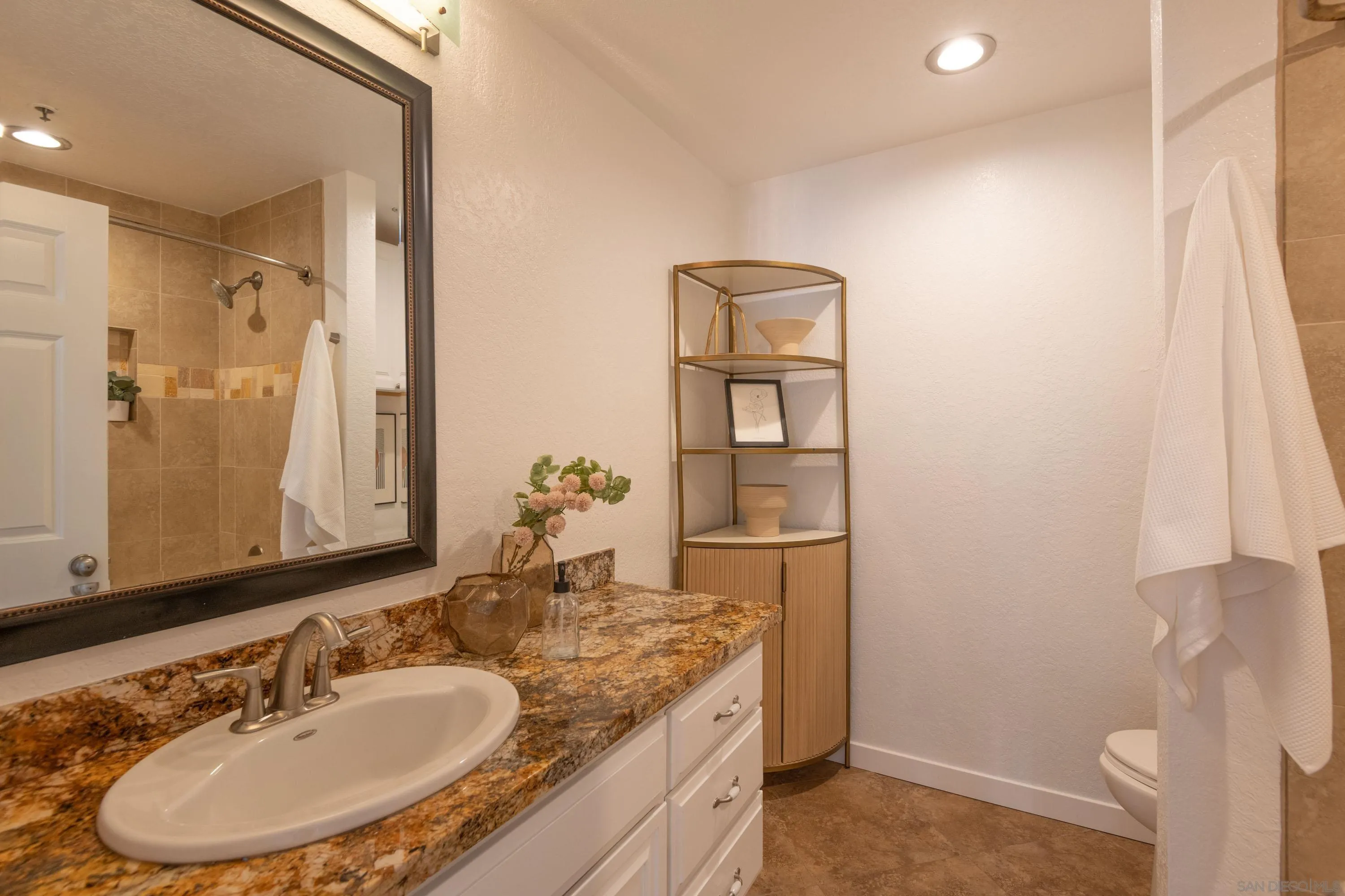 5705 Friars Road, Unit 54 San Diego, CA 92110 - Photo 21 of 30 a bathroom with a sink and a mirror
