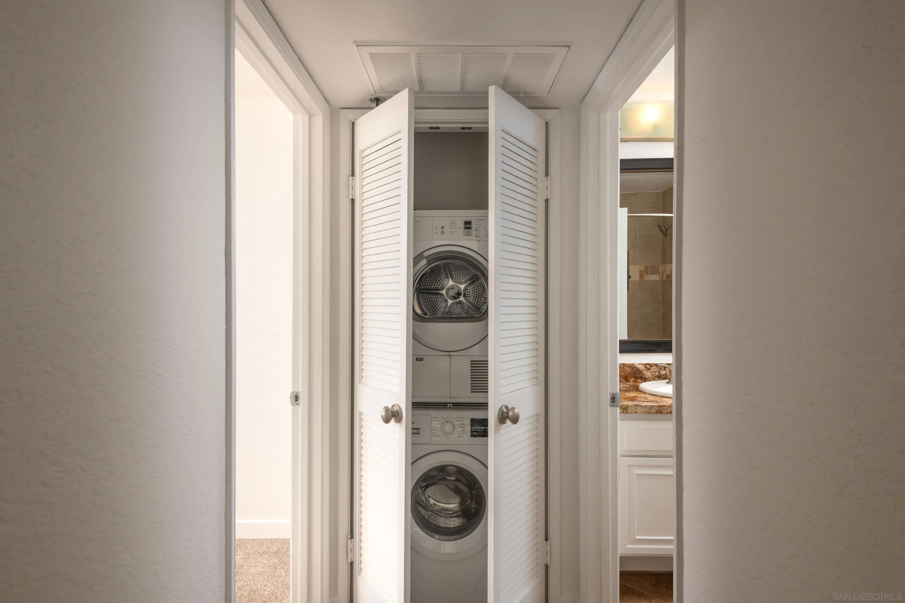 5705 Friars Road, Unit 54 San Diego, CA 92110 - Photo 22 of 30 a view of entryway with washer and dryer