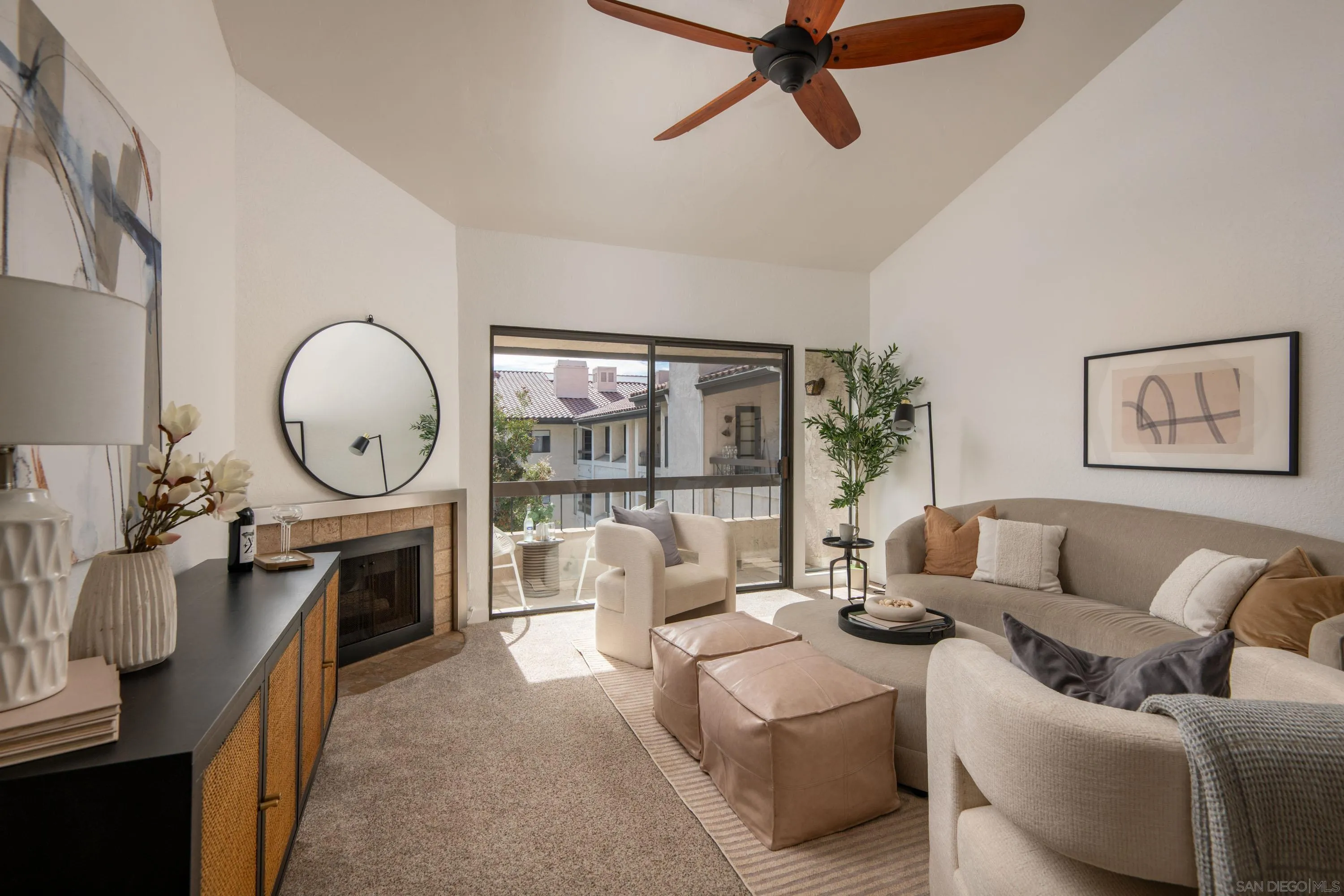 5705 Friars Road, Unit 54 San Diego, CA 92110 - Photo 4 of 30 a living room with furniture a fireplace and a large window
