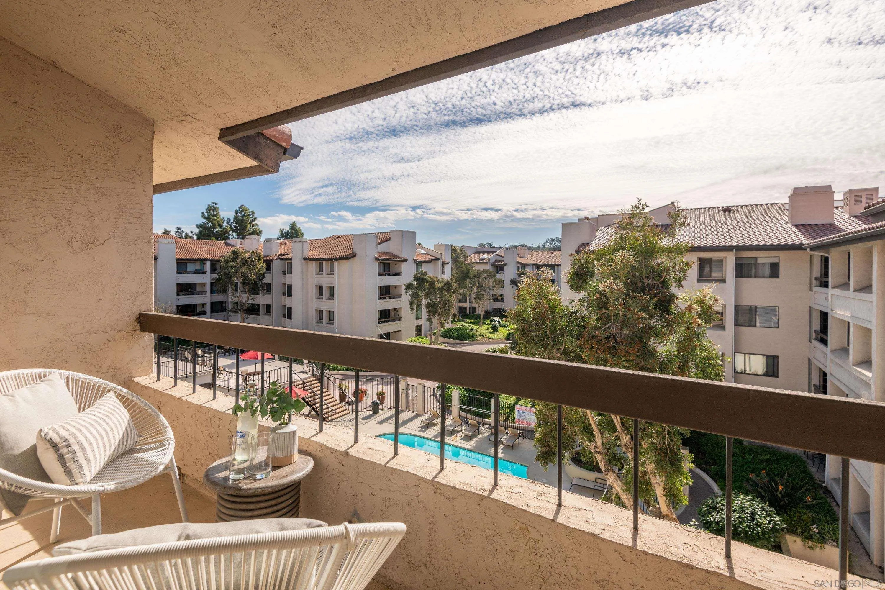 5705 Friars Road, Unit 54 San Diego, CA 92110 - Photo 6 of 30 a view of a balcony with dining table and chairs