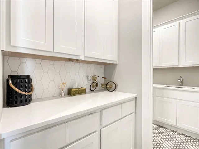 a kitchen with a sink a washer and dryer