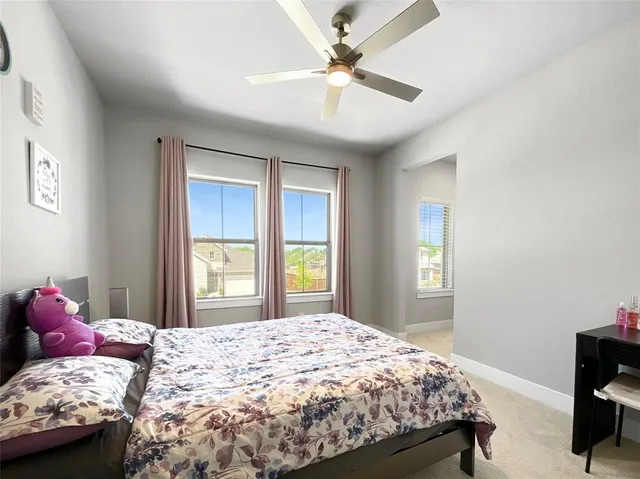 a bedroom with a bed and a table