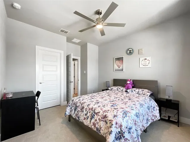 a bathroom with a sink a toilet a mirror and shower