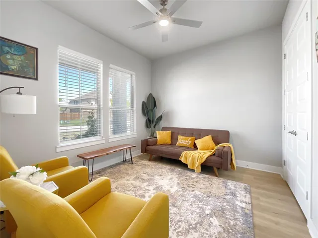 a living room with furniture and a large window