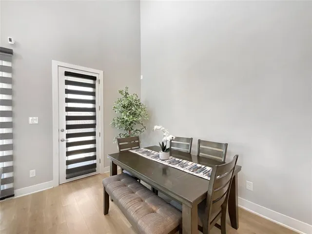 a view of a workspace with furniture and wooden floor